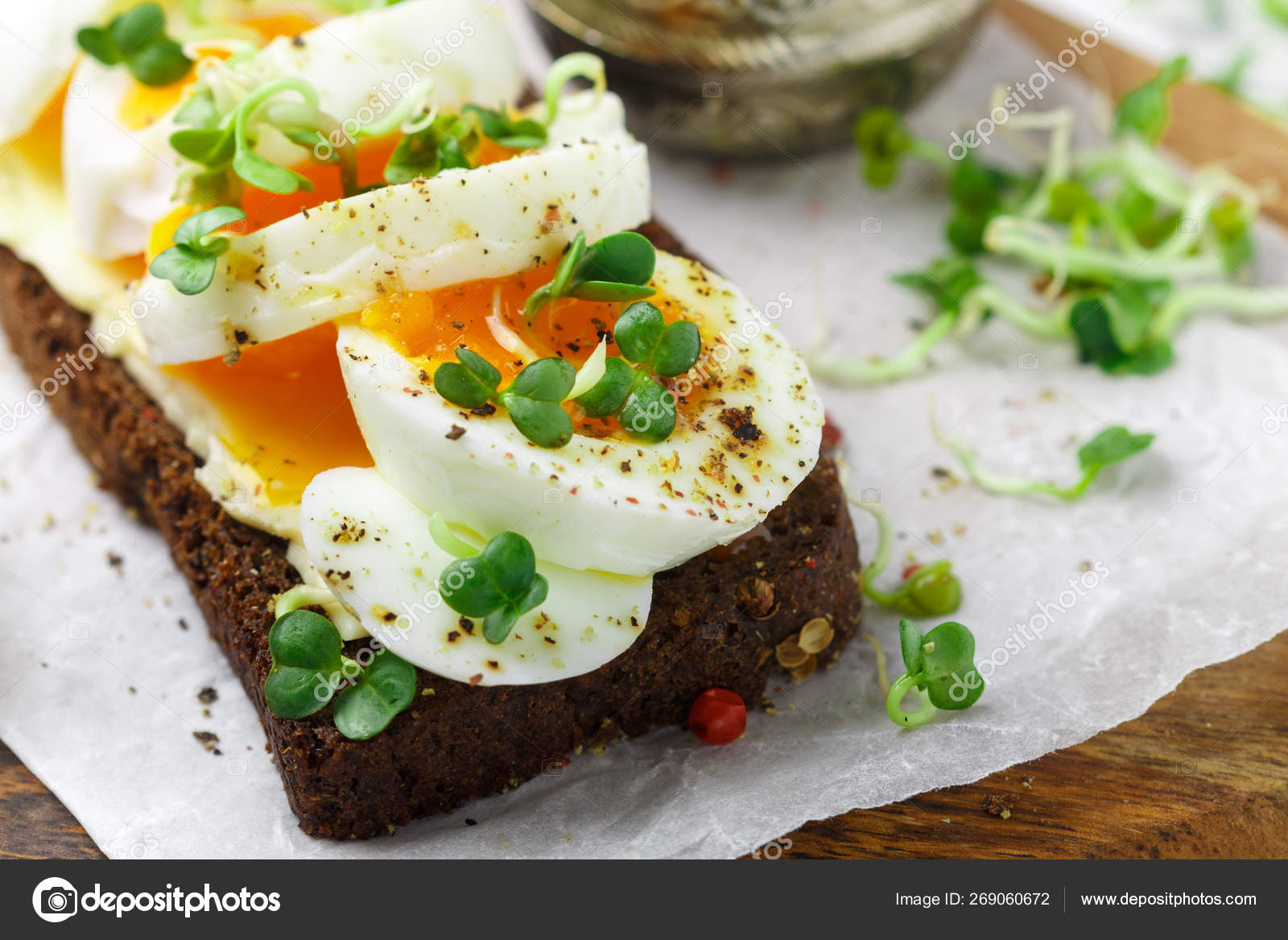 Rye bread sandwich with boiled egg, cheese, freshly ground peppe