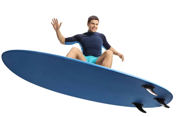 Beyaz Arka Plan Üzerinde Izole Bir Surfboard Ile Atlama Sörfçü — Stok fotoğraf