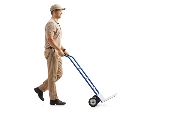 Full Length Profile Shot Delivery Man Pushing Empty Hand Truck — Stock Photo, Image