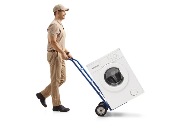 Full Length Profile Shot Delivery Man Pushing Hand Truck Loaded — Stock Photo, Image