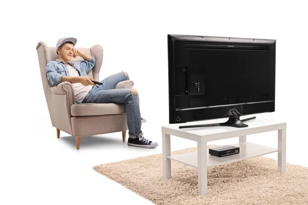 Teenager Seated Armchair Holding Remote Control Watching Television Isolated White — Stock Photo, Image