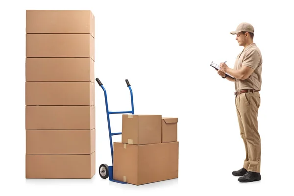 Full Length Profile Shot Delivery Man Standing Next Hand Truck — Stock Photo, Image