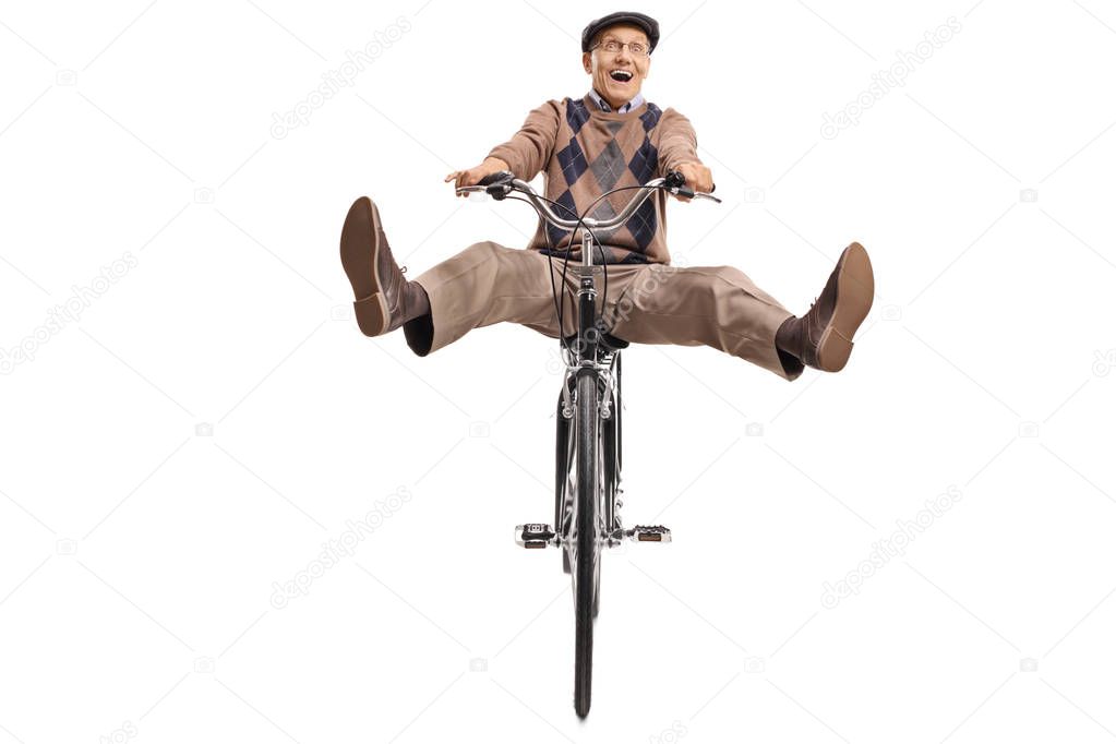 Overjoyed senior riding a bicycle isolated on white background