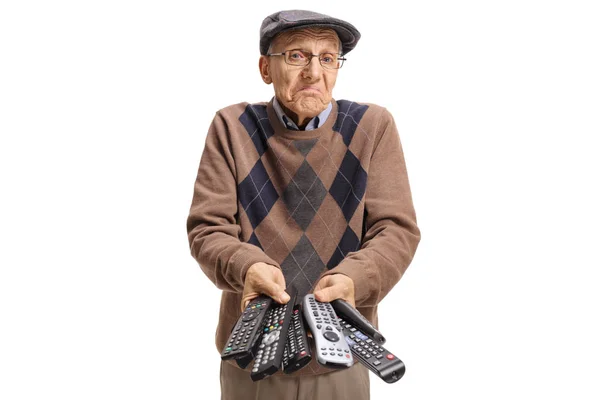 Confused Elderly Man Holding Bunch Remotes Isolated White Background — Stock Photo, Image