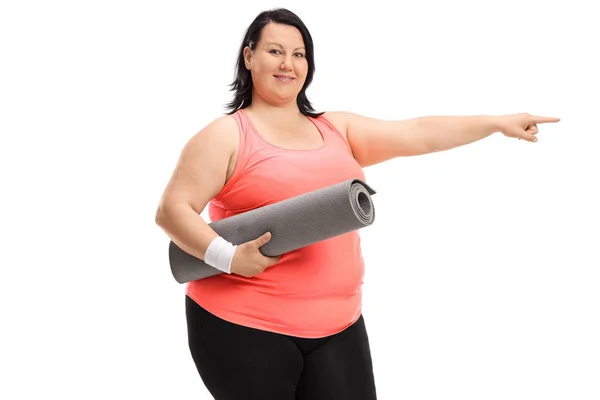 Overweight Woman Exercise Mat Pointing Isolated White Background — Stock Photo, Image