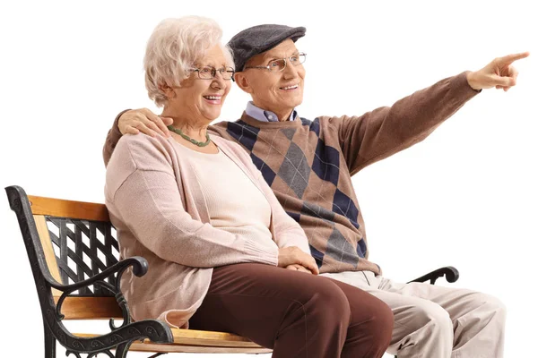 Mature Woman Mature Man Sitting Bench Man Pointing Isolated White — Stock Photo, Image