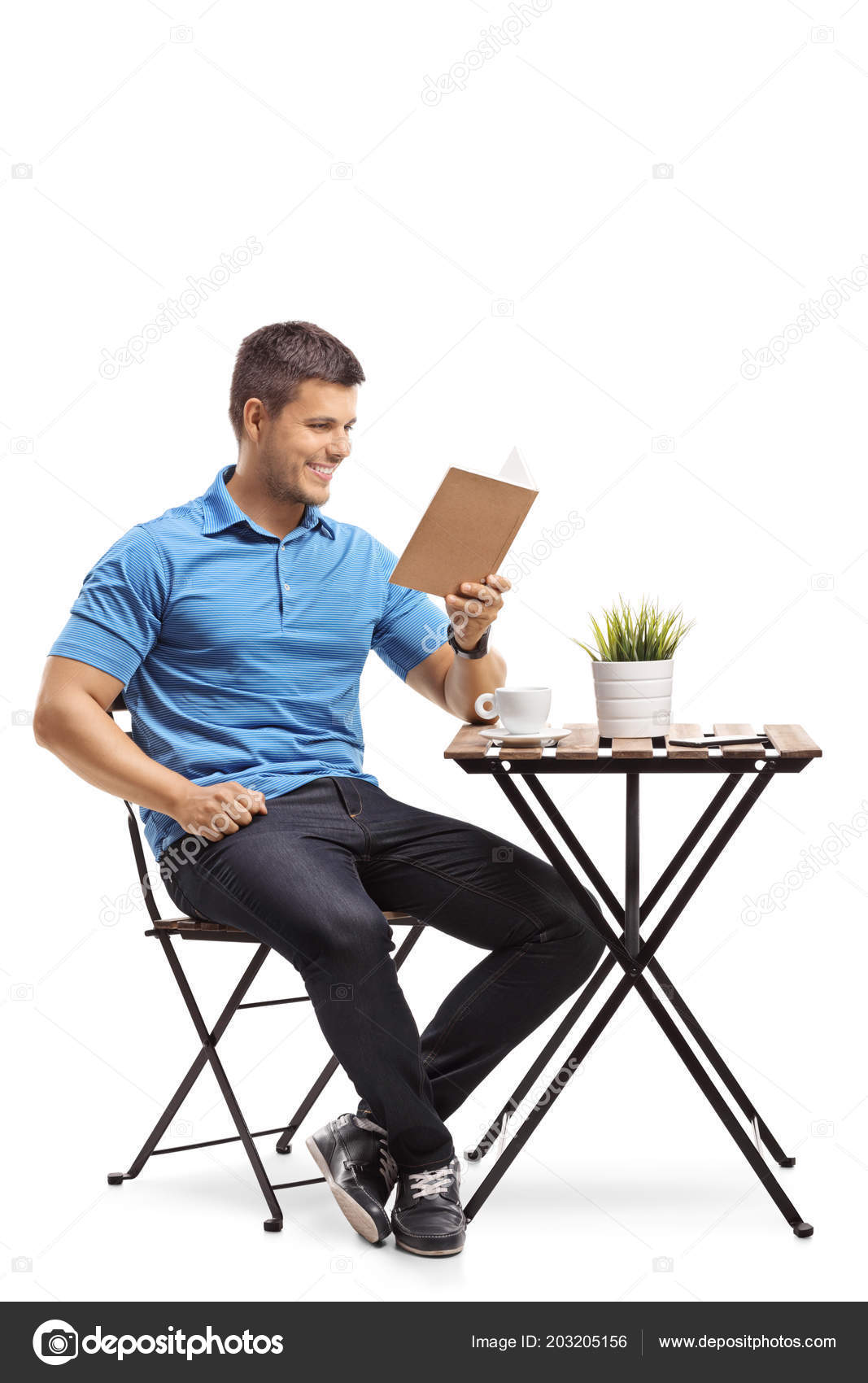 Young Man Sitting Coffee Table Reading Book Isolated White