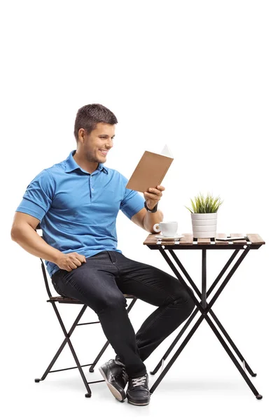 Young Man Sitting Coffee Table Reading Book Isolated White Background — Stock Photo, Image