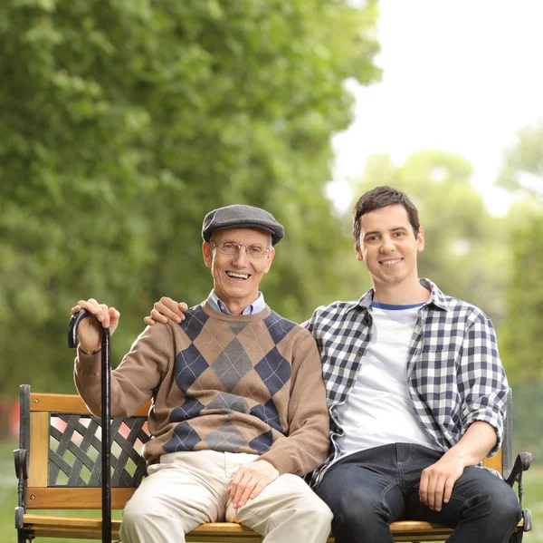 Elderly Man Young Guy Sitting Bench Outdoors — Stock Photo, Image