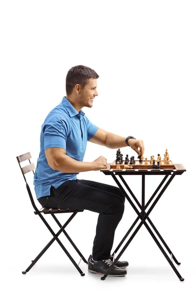 Jonge Kerel Zittend Aan Een Tafel Spelen Schaak Geïsoleerd Witte — Stockfoto