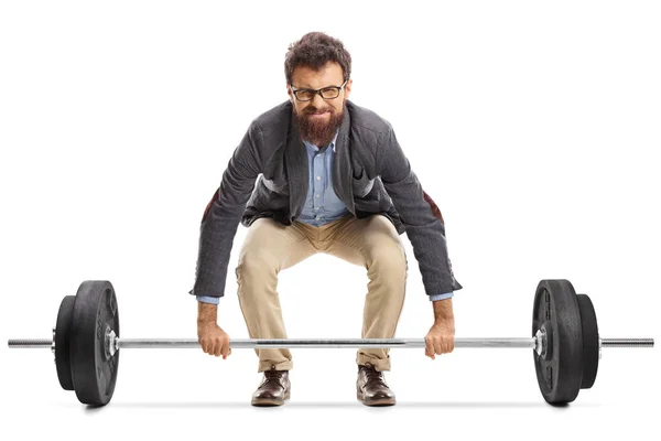 Young man struggling to lift a barbell isolated on white background