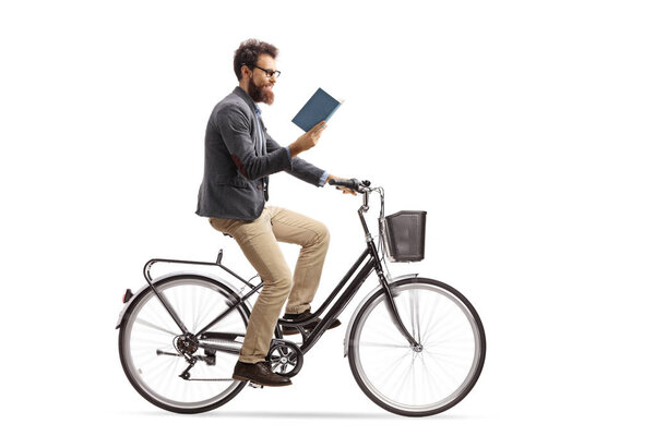 Young man riding a bicycle and reading a book isolated on white background