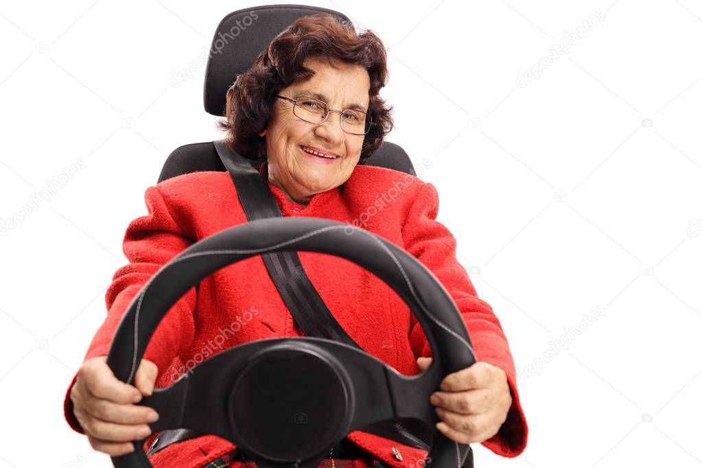 Senior lady sitting in a car seat driving isolated on white background