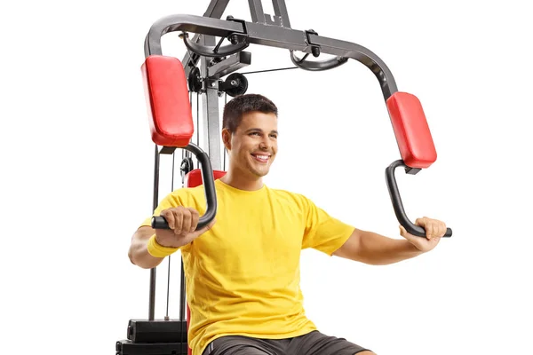 Jonge Man Uit Oefenen Een Fitness Machine Geïsoleerd Witte Achtergrond — Stockfoto