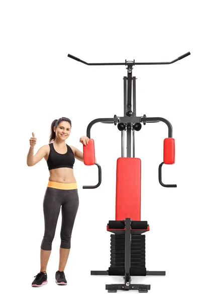 Full Length Portrait Young Woman Sportswear Exercise Machine Making Thumb — Stock Photo, Image