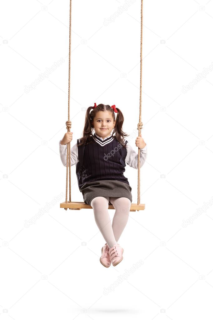 Schoolgirl on a swing isolated on white background