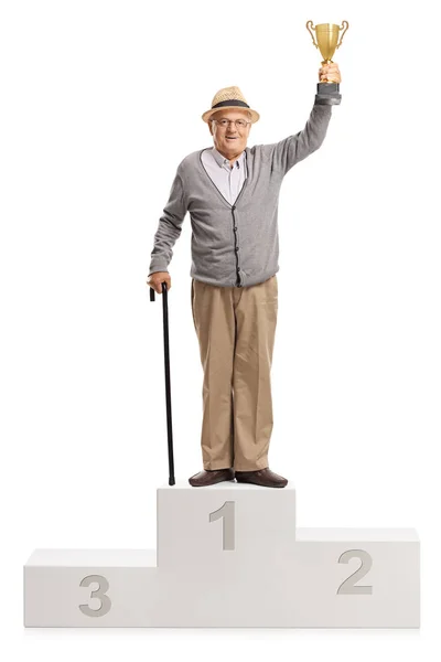 Full Length Portrait Senior Man Standing Winner Pedestal Holding Gold — Stock Photo, Image