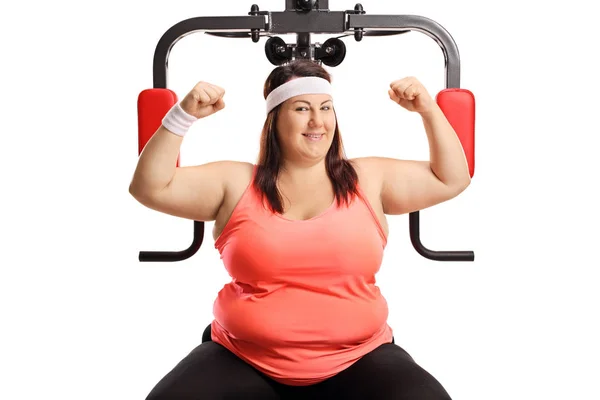 Corpulent Woman Showing Muscles Exercising Machine Isolated White Background — Stock Photo, Image