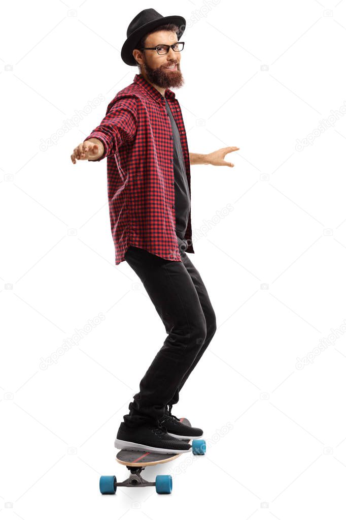 Full length portrait of a man riding a skateboard isolated on white background