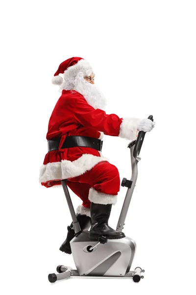 Noel Baba Beyaz Arka Plan Üzerinde Izole Bir Sabit Bisiklet — Stok fotoğraf