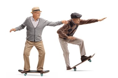 Full length profile shot of two elderly men skateboarding isolated on white background clipart
