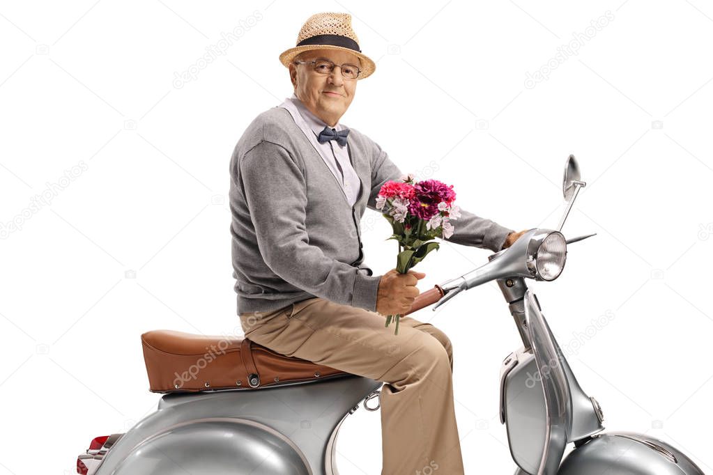 Gentleman on a scooter holding a bouquet of flowers isolated on white background 