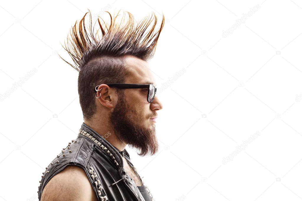 Profile face shot of a male punker with mohawk hairstyle isolated on white background