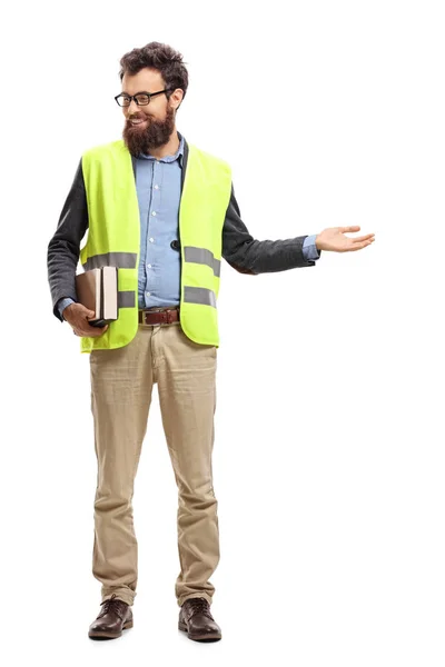 Retrato Completo Hombre Sosteniendo Libros Llevando Chaleco Seguridad Dando Bienvenida —  Fotos de Stock