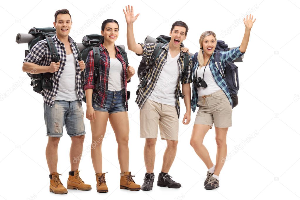Group of cheerful hikers with backpacks isolated on white background