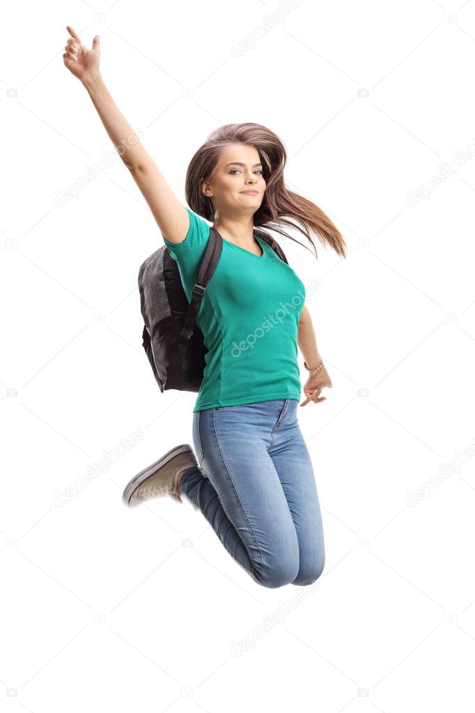 Beautiful female student jumping isolated on white background