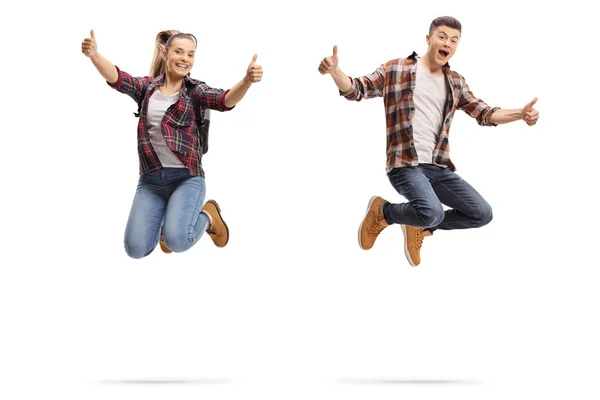 Teen Boy Girl Jumping Showing Thumbs Isolated White Background — Stock Photo, Image