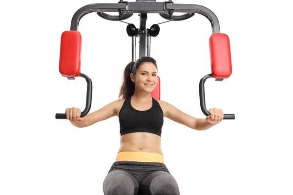 Exercício Feminino Sorridente Uma Máquina Fitness Multifuncional Isolada Fundo Branco — Fotografia de Stock