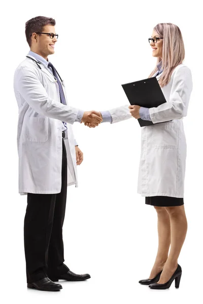 Full Length Shot Young Male Female Doctor Shaking Hands Isolated — Stock Photo, Image