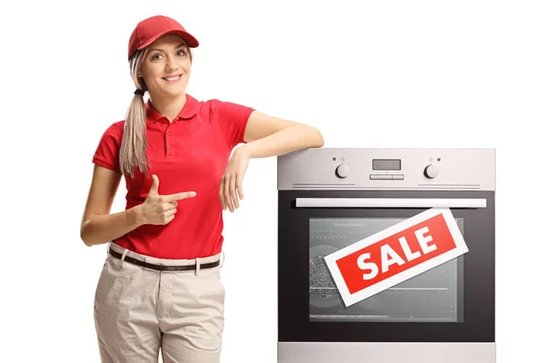 Young Saleswoman Pointing Electrcal Oven Sale Isolated White Background — Stock Photo, Image