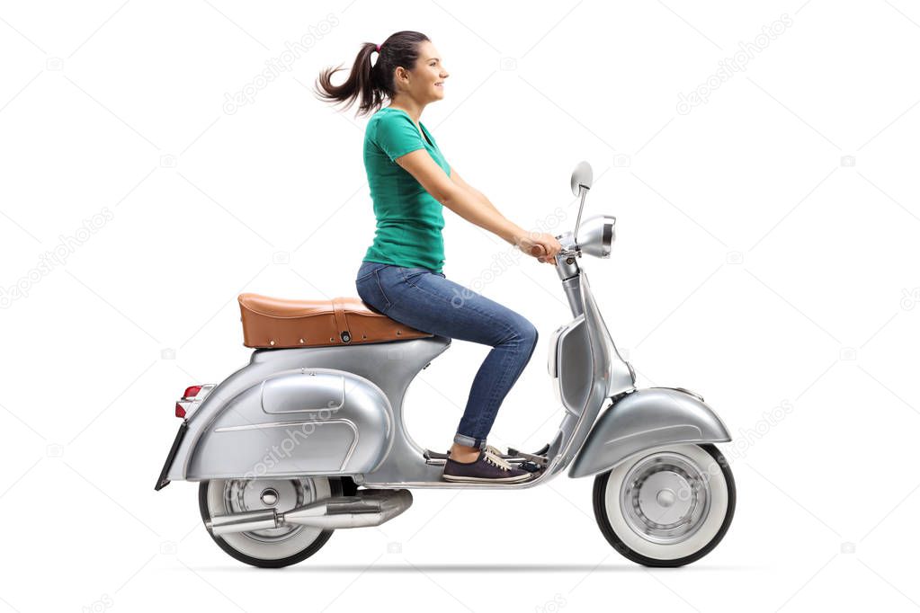 Full length shot of a girl riding a vintage scooter isolated on white background