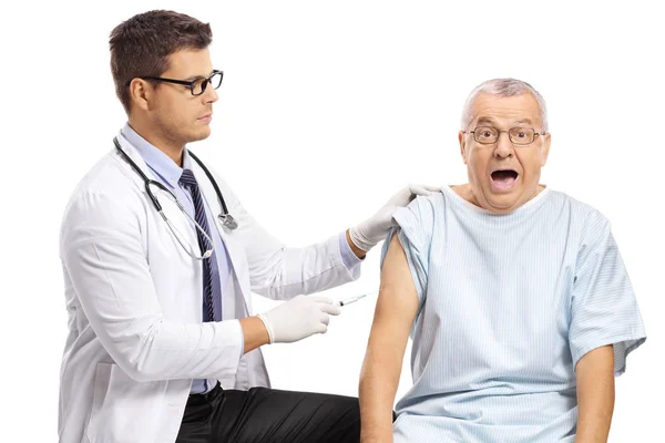 Young Male Doctor Giving Injection Shot Scared Mature Patient Isolated — Stock Photo, Image