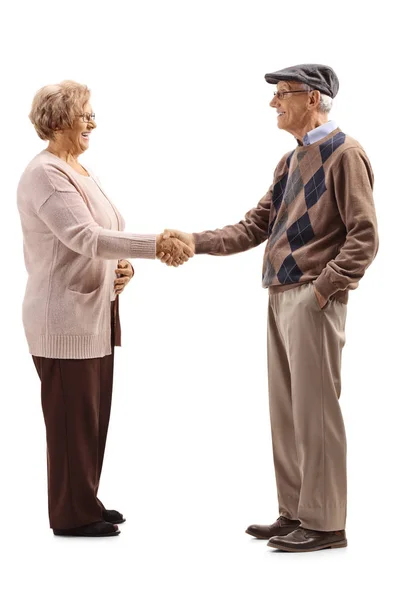シニアの男と女の握手は 白い背景で隔離の全身ショット — ストック写真