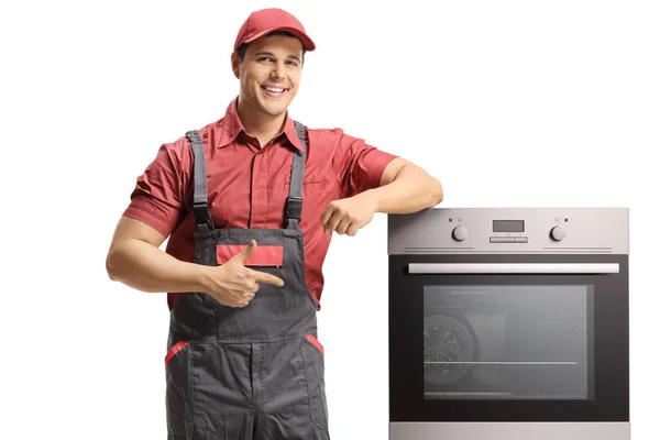 Reparateur Leunen Een Elektrische Oven Geïsoleerd Een Witte Achtergrond Aan — Stockfoto