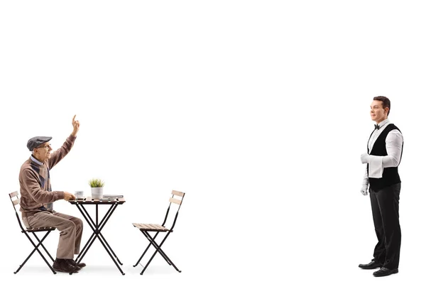 Senior Man Sitting Coffee Table Gesturing Call Waiter Standing Isolated — Stock Photo, Image