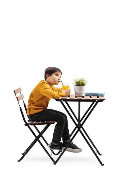 Full Length Shot Little Boy Drinking Juice Table Looking Awayisolated — Stock Photo, Image