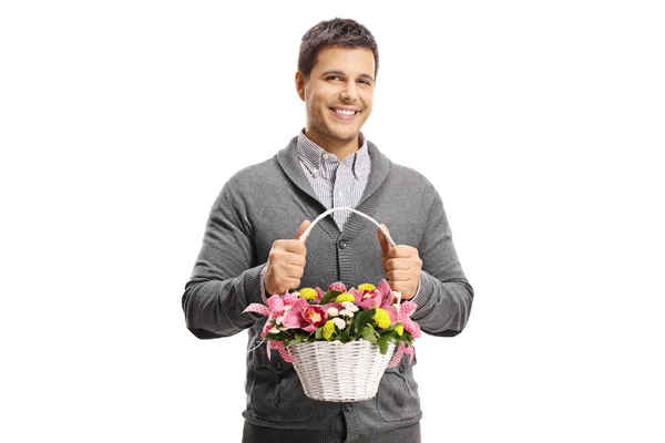 Feliz Joven Sosteniendo Flores Una Cesta Aislada Sobre Fondo Blanco — Foto de Stock