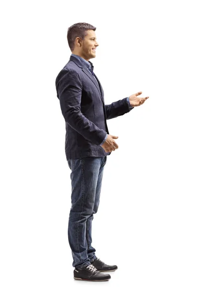 Full Length Profile Shot Young Man Standing Gesticulating Conversation Isolated — Stock Photo, Image