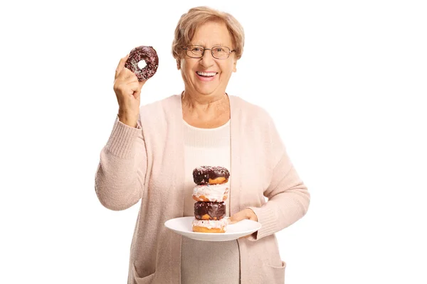 Cheerful Elderly Woman Holding Plate Doughnuts One Hand One Doughnut — Stock Photo, Image