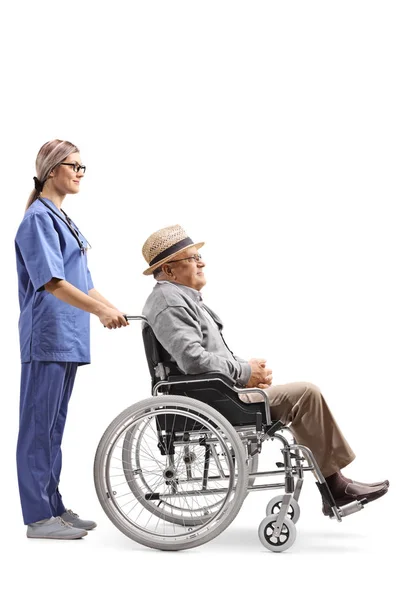 Full Length Profile Shot Young Female Nurse Pushing Elderly Gentleman — Stock Photo, Image