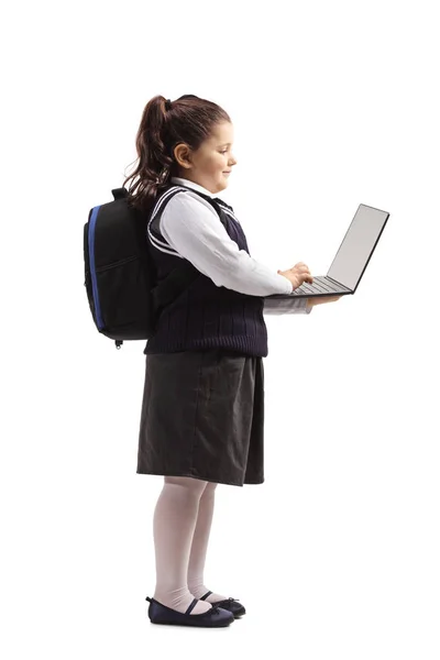 Full Length Profile Shot Little Schoolgirl Uniform Standing Using Laptop — Stock Photo, Image