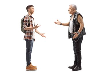 Full length profile shot of a male teenage student talking to a mature male punker in a leather vest isolated on white background clipart