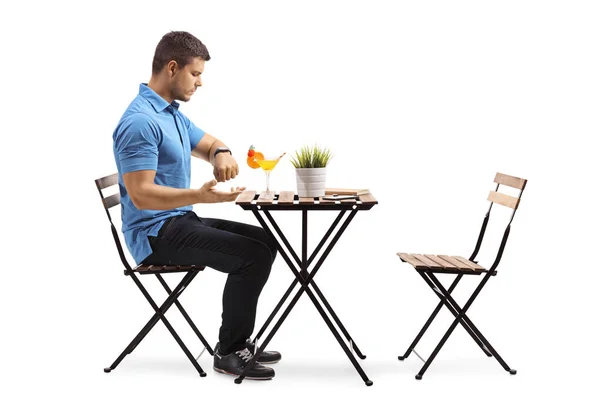Full Length Profile Shot Young Man Sitting Cafe Cocktail Looking — Stock Photo, Image