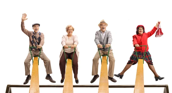 Fröhliche Senioren Amüsieren Sich Auf Einer Wippe Auf Weißem Hintergrund — Stockfoto