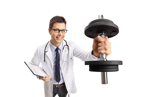 Young Male Doctor Holding Dumbbell Clipboard Isolated White Background — Stock Photo, Image