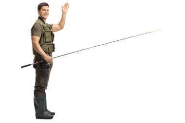 Full length shot of a young male fisherman holding a fishing rod and waving at the camera isolated on white background